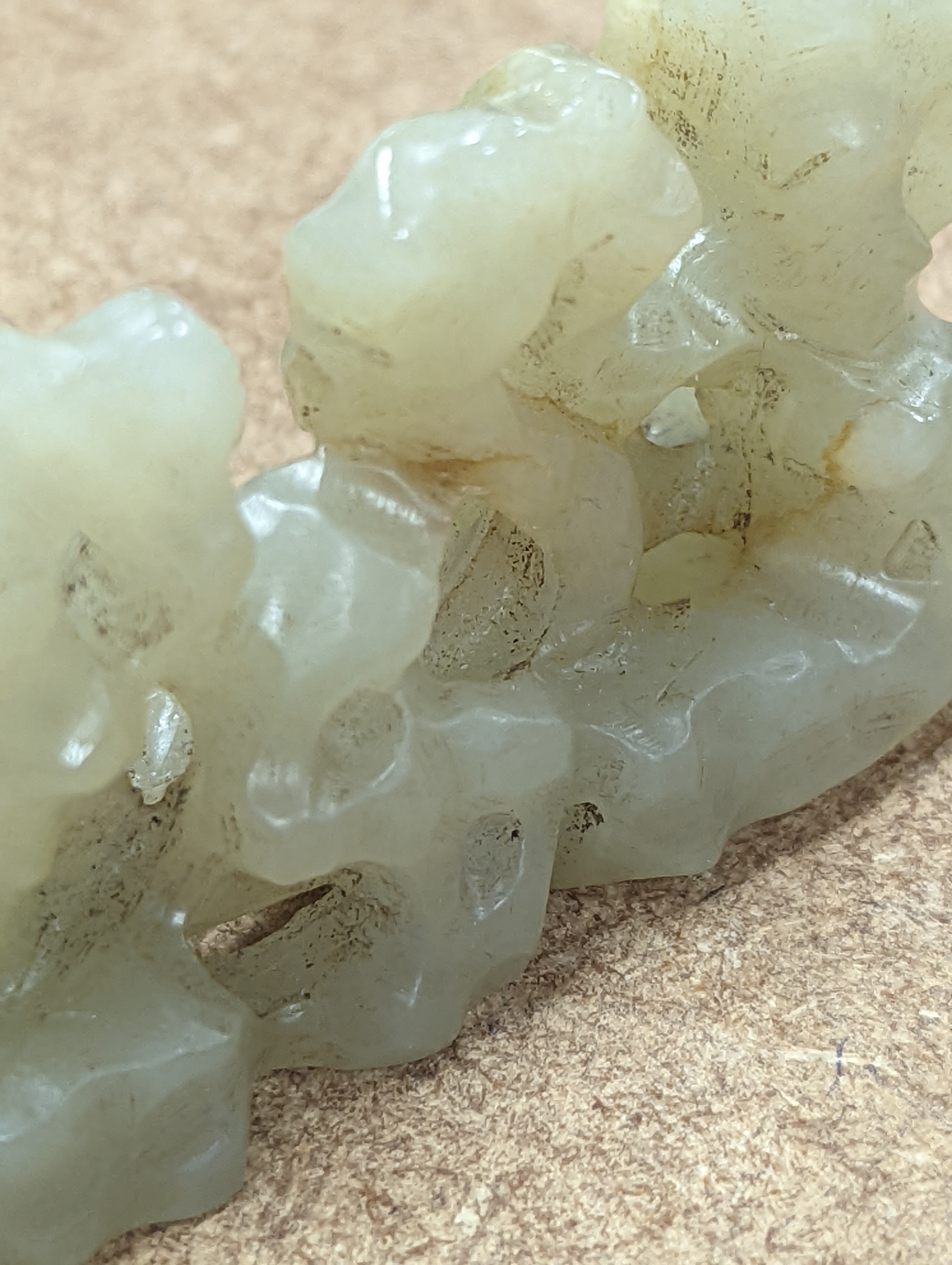 A Chinese celadon jade brush rest, 8cms wide